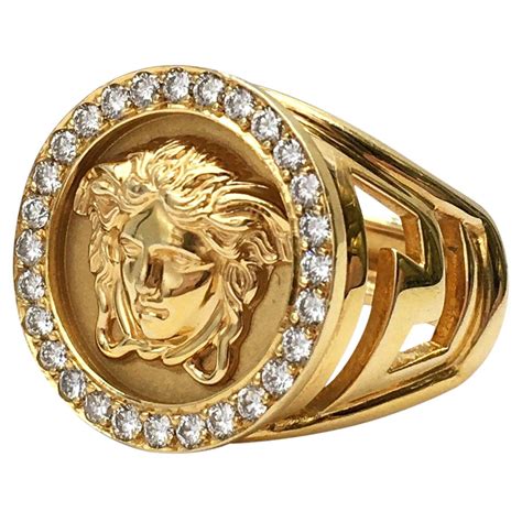 a ring from iraq with the versace logo and enamel|gold label Versace ring.